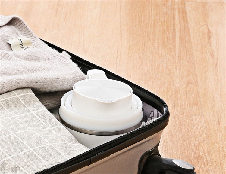 美的（Midea）电水壶/热水瓶0.6L折叠水壶旅行迷你便携式烧水壶小型家用压缩电热水壶SH06Simple101白色